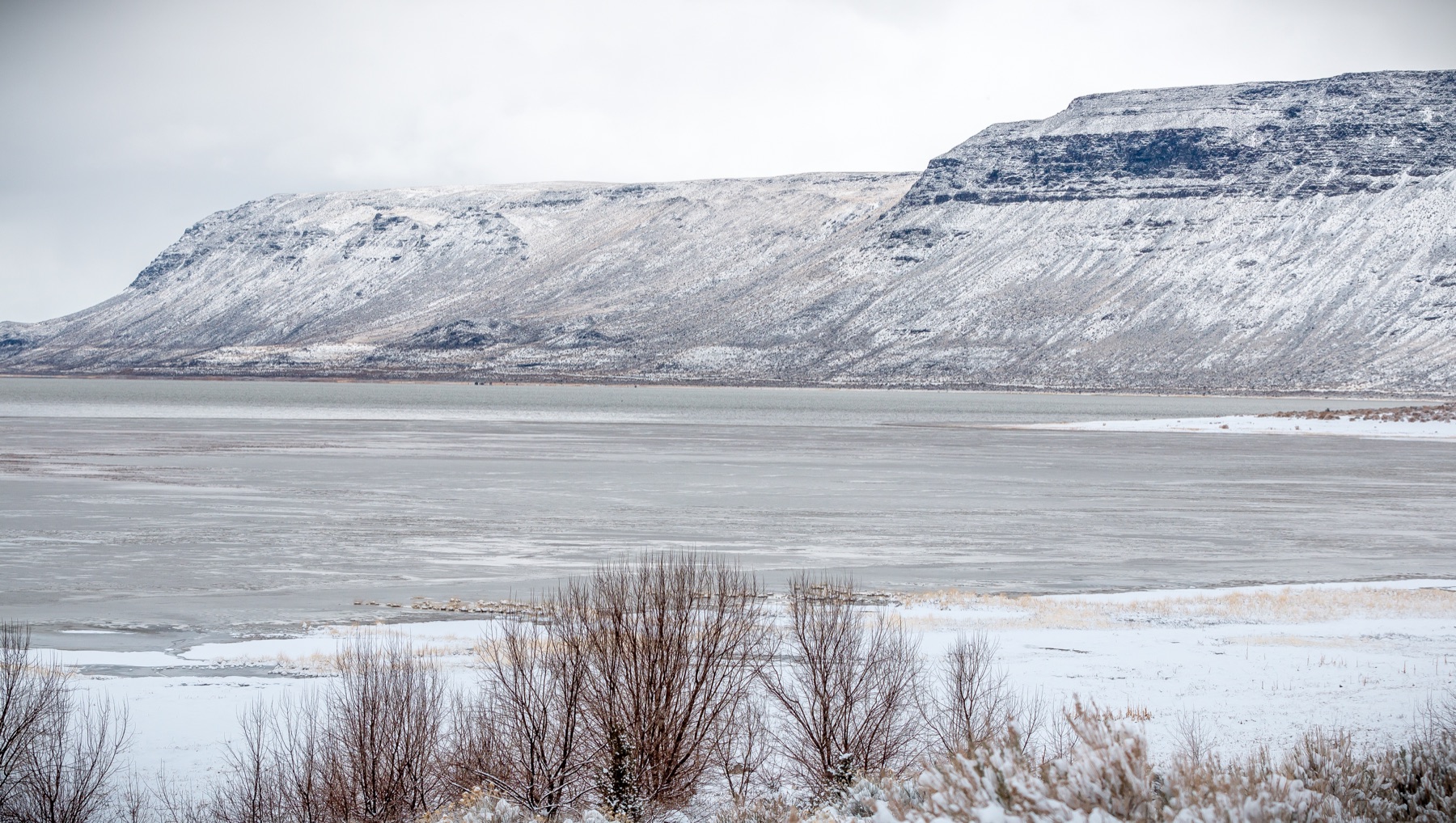 Snow-covered Abert Rim rising above Lake Abert